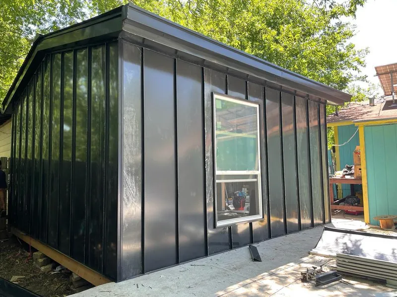 Black standing seam metal wall panels for Roof Inspection in Greendale