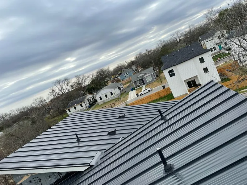 Standing seam metal roof panels with vents for Skylight Repair in Greendale
